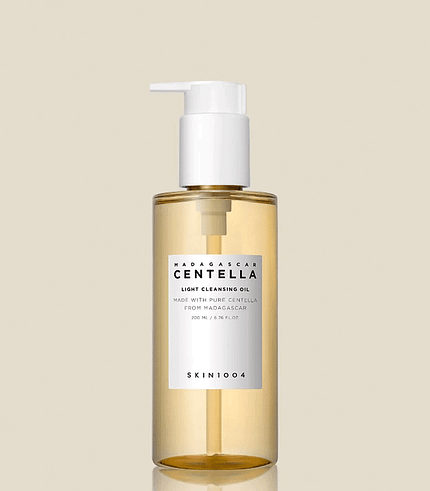 SKIN1004 Madagascar Centella Light Cleansing foam surrounded by skincare products on a vanity table